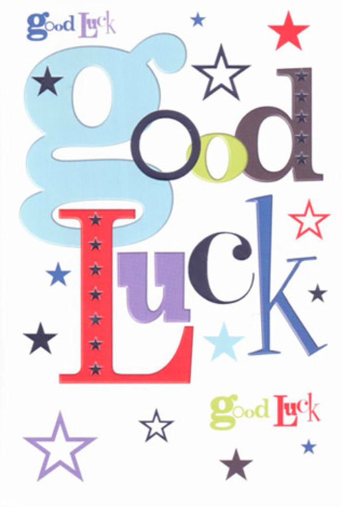 The image shows a luck-themed greeting card that feels like a mini celebration in print, the design buzzing with colour and movement while staying clean and uncluttered. Centred on a bright, matte-white background, the words Good Luck stretch confidently across the card in a medley of fonts that each bring their own personality. One letter might be a wide, dreamy pastel blue; the next, a sleek midnight black; then a vivid red or a deep, mulled-wine purple, all arranged so they almost seem to chat and laugh together. The composition recalls the energy of Guildford's bustling High Street on a Saturday, where shop signs, flower stalls, and conversations blend into something warmly alive. Around the letters, lively stars in moss green, soft lilac, slate navy, and powder blue swoop and scatter, some bold and sharply outlined, others pale and feather-light, fading as if they're drifting off into the distance like fireworks glimpsed above the River Wey. They cluster more thickly at the edges and loosen as they near the words, creating a sense of the message glowing gently at the centre. The printing looks crisp and precise, hinting at a silky, smooth card surface that would feel cool and reassuring in the hand, like the firm stems of freshly conditioned flowers tied with a neat ribbon. Though silent, the card seems to cheer from the sidelines, echoing the kind of heartfelt support friends might share over coffee near Castle Street before a big interview or exam. It is easy to imagine this card propped beside a simple glass vase of seasonal blooms, quietly radiating hope, courage, and the belief that a new chapter can begin with colour, kindness, and a little bit of luck.