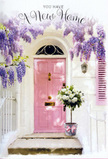 Here, a Guildford doorway is styled like a love letter to fresh beginnings, the scene composed with the same care a florist gives to a special housewarming bouquet. The front door, painted a gentle, dusty pink, stands slightly recessed in a whitewashed wall, its colour soft enough to feel calming yet distinctive enough to suggest personality and warmth. Above and around it, wisteria trails in luxurious cascades of lavender and lilac, the flowers hanging in thick, scented clusters that frame the door like a floral arch, reminiscent of the blossoming gardens you might see near Stoke Park in late spring. A pale pastel shutter to one side balances the composition, its surface catching streaks of sunlight that filter through the leaves, creating a play of light and shadow across the facade. On the doorstep sits a weathered grey bucket, intentionally rustic, brimming with an arrangement of white and cream roses. Their petals look velvety and cool, layered in soft spirals, each bloom cradled by sprigs of muted green foliage that add a natural, relaxed texture. Around the bucket is tied a pink satin ribbon, the bow modest but perfectly formed, echoing the hue of the door so that everything feels harmoniously curated. The stone step beneath is simple and unadorned, highlighting the flowers as the true focal point. The atmosphere in the image is tender and uplifting, suggestive of a key freshly turned in the lock, a family moving in, or a heartfelt congratulations for a new address in Guildford-where the doorway, wrapped in wisteria and roses, quietly promises that this house will soon feel like home.